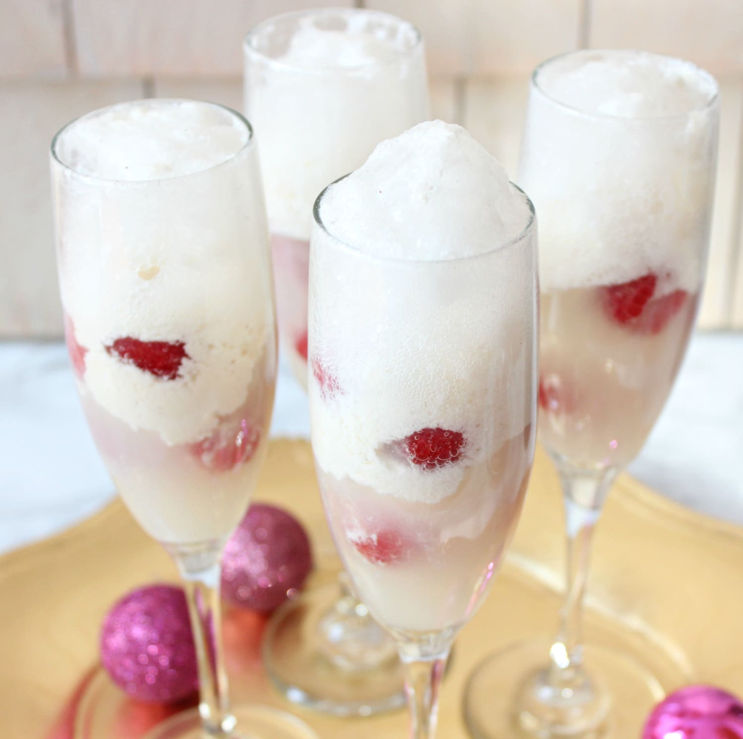 This delicious Raspberry Champagne Float cocktail is perfect for the holidays!