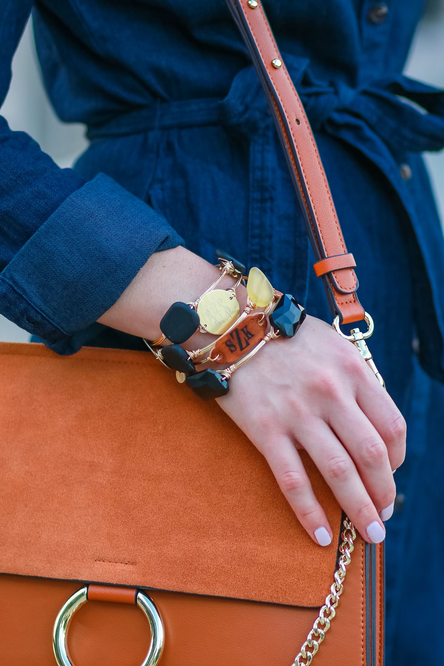Cute casual tailgating outfit and easy side braid hairstyle | Twisted side braid hair tutorial | Target denim shirt dress with cognac booties, a Chleo Faye lookalike bag, and monogrammed jewelry | Fall Hairstyle to Try: Simple Twisted Side Braid from Hair Cuttery by southern blogger Stephanie Ziajka from Diary of a Debutante