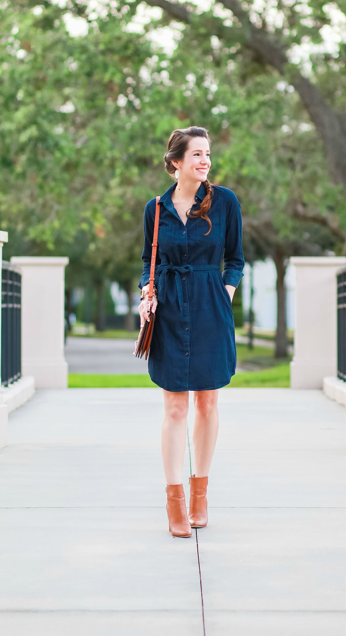 Cute casual tailgating outfit and easy side braid hairstyle | Twisted side braid hair tutorial | Target denim shirt dress with cognac booties, a Chleo Faye lookalike bag, and monogrammed jewelry | Fall Hairstyle to Try: Simple Twisted Side Braid from Hair Cuttery by southern blogger Stephanie Ziajka from Diary of a Debutante