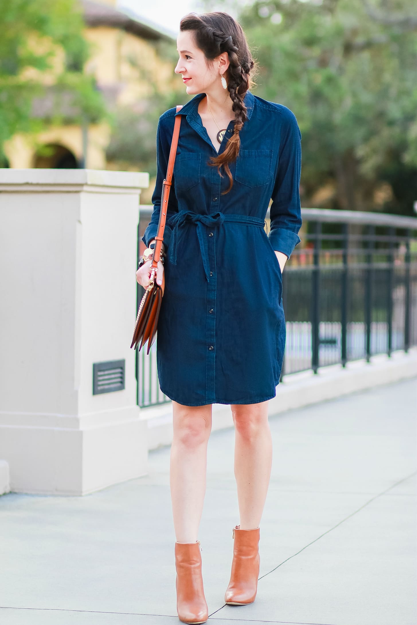 Cute casual tailgating outfit and easy side braid hairstyle | Twisted side braid hair tutorial | Target denim shirt dress with cognac booties, a Chleo Faye lookalike bag, and monogrammed jewelry | Fall Hairstyle to Try: Simple Twisted Side Braid from Hair Cuttery by southern blogger Stephanie Ziajka from Diary of a Debutante