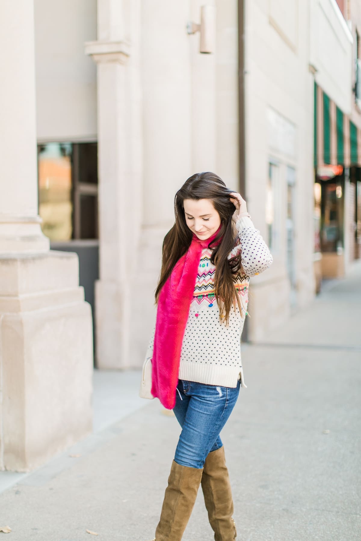 Colorful Christmas sweater ideas from Talbots, featuring their Carnival Fair Isle Sweater, Pink Faux Fur Pull Through Scarf, and Canvas Stripe Makeup Pouch styled with AG the Legging ankle jeans, taupe Free People Liberty boots, and cognac Kendra Scott Skylar earrings by southern fashion blogger Stephanie Ziajka from Diary of a Debutante Colorful Christmas sweater ideas from Talbots, featuring their Carnival Fair Isle Sweater, Pink Faux Fur Pull Through Scarf, and Canvas Stripe Makeup Pouch styled with AG the Legging ankle jeans, taupe Free People Liberty boots, and cognac Kendra Scott Skylar earrings by southern fashion blogger Stephanie Ziajka from Diary of a Debutante