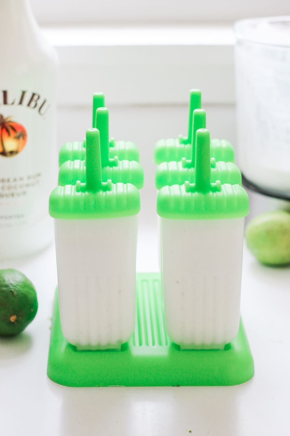 Blogger Stephanie Ziajka shows how to make frozen alcoholic popsicles with coconut milk and Malibu Rum on Diary of a Debutante