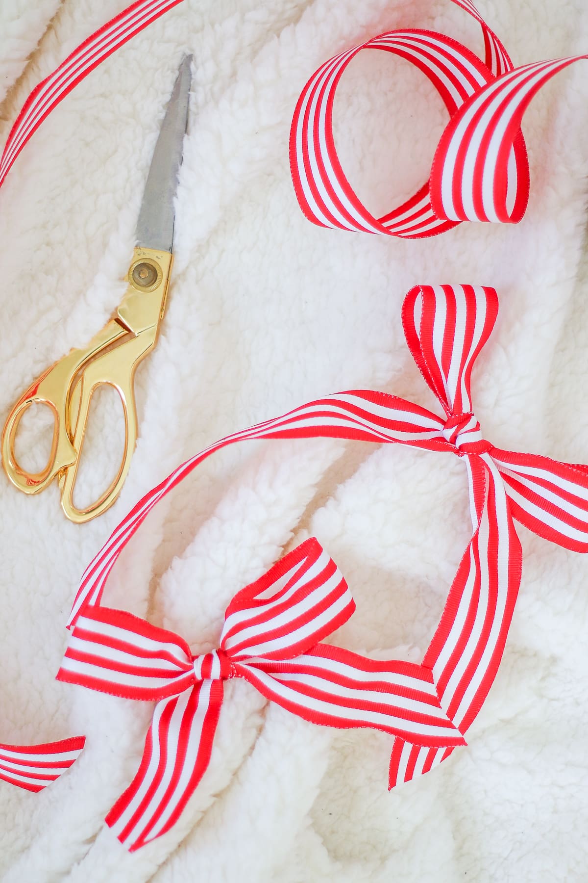 Red and white striped ribbon used to make DIY Christmas gifts by blogger Stephanie Ziajka on Diary of a Debutante Red and white striped ribbon used to make DIY Christmas gifts by blogger Stephanie Ziajka on Diary of a Debutante