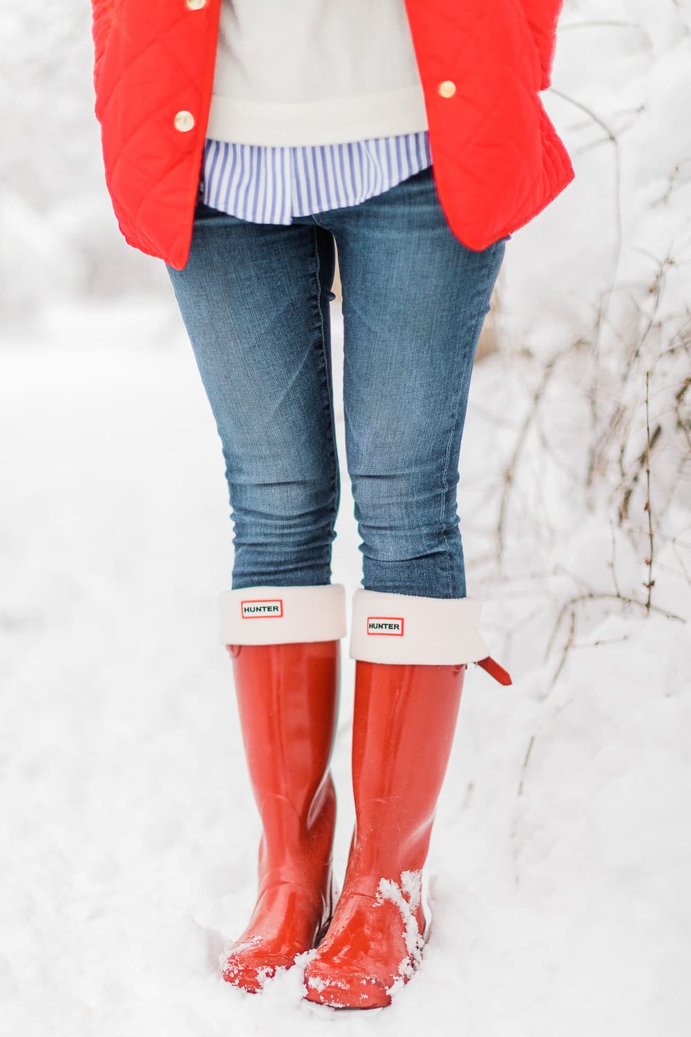 Preppy Winter Outfit: Red Quilted Jacket with Matching Red Hunter Boots by affordable fashion blogger Stephanie Ziajka from Diary of a Debutante, how to style red Hunter boots with tall welly boot socks, how to style a red quilted jacket, red quilted jacket styled with red tall Hunter boots, Hunter tall welly boot socks, a blue striped oxford, white crewneck sweater, and skinny jeans Preppy Winter Outfit: Red Quilted Jacket with Matching Red Hunter Boots by affordable fashion blogger Stephanie Ziajka from Diary of a Debutante, how to style red Hunter boots with tall welly boot socks, how to style a red quilted jacket, red quilted jacket styled with red tall Hunter boots, Hunter tall welly boot socks, a blue striped oxford, white crewneck sweater, and skinny jeans