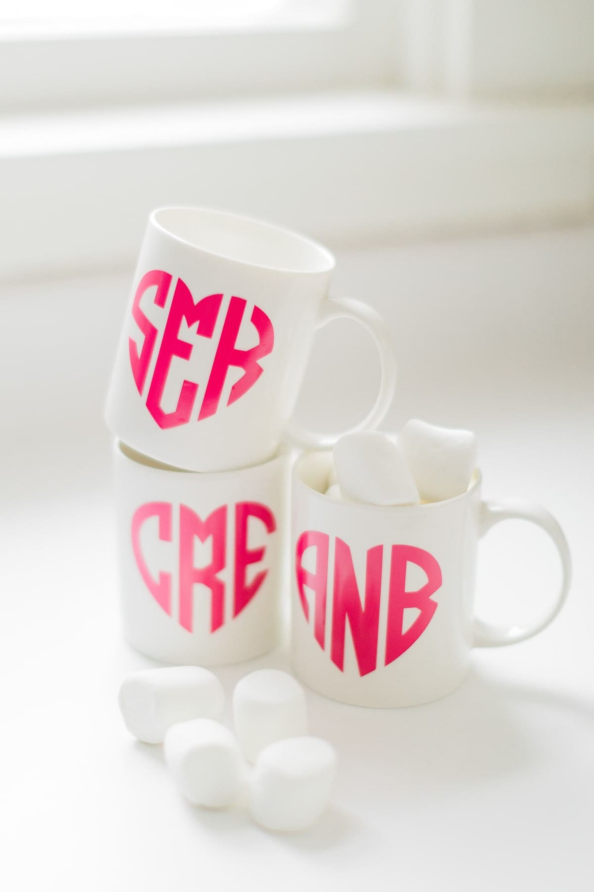 DIY coffee mug with heart shaped Cricut monogram by DIY blogger Stephanie Ziajka of Diary of a Debutante