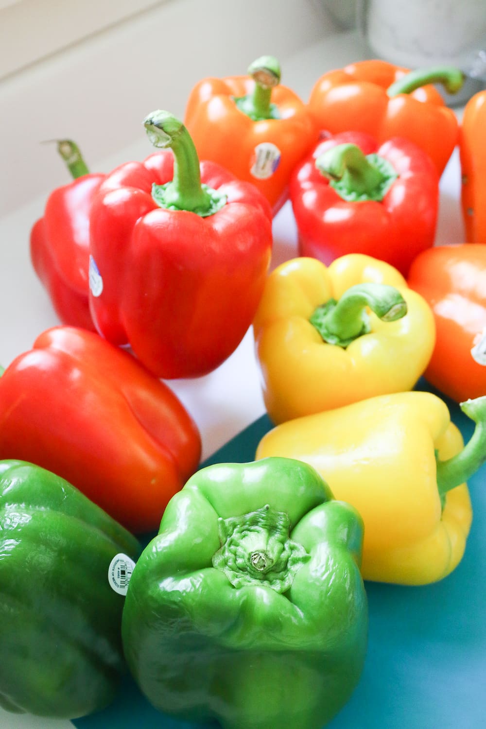 Fresh red, yellow, orange, and green bell peppers to be used for skewering on Diary of a Debutante Fresh red, yellow, orange, and green bell peppers to be used for skewering on Diary of a Debutante