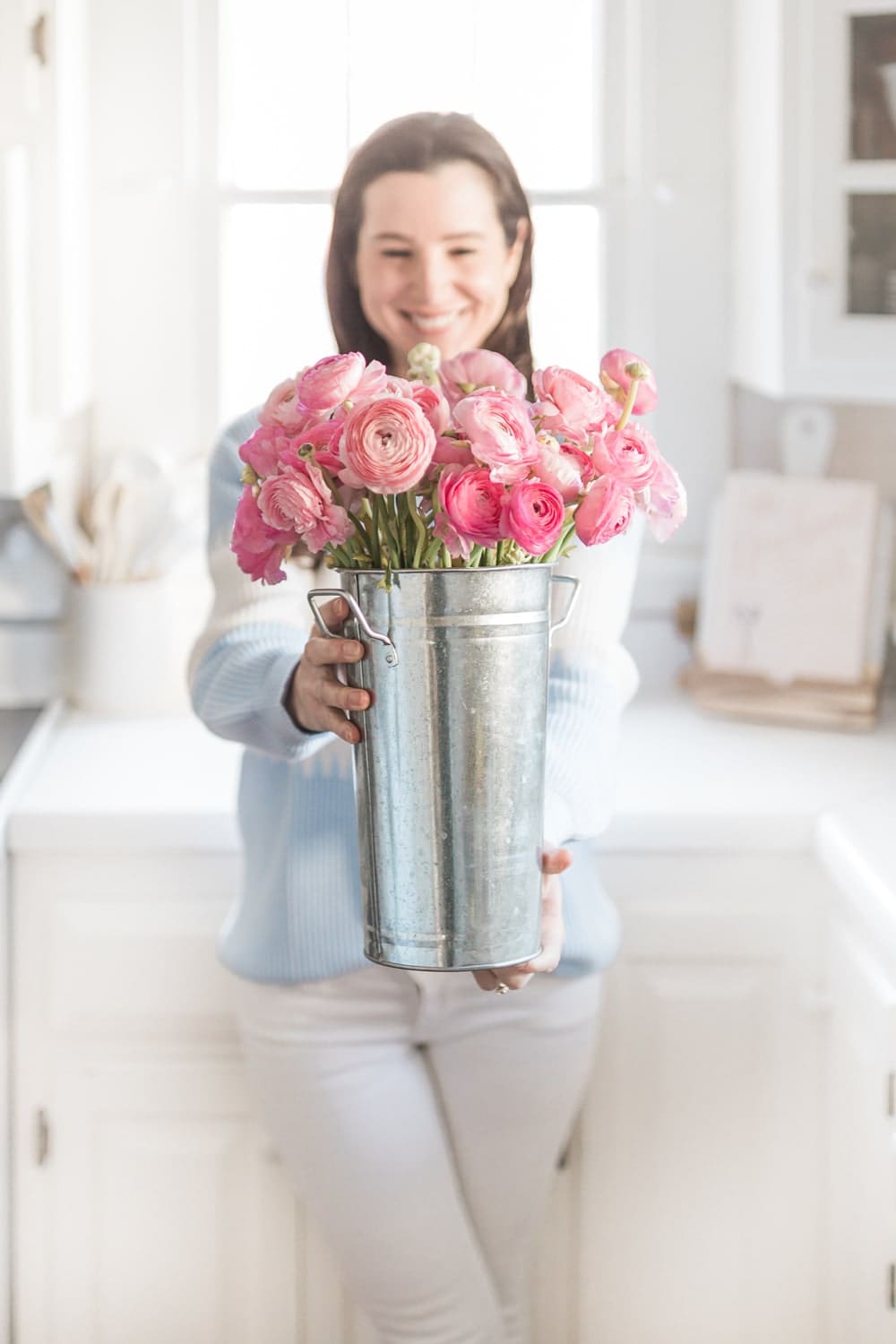 Blogger Stephanie Ziajka holds hot pink ranunculus in a galvanized flower bucket on Diary of a Debutante Blogger Stephanie Ziajka holds hot pink ranunculus in a galvanized flower bucket on Diary of a Debutante