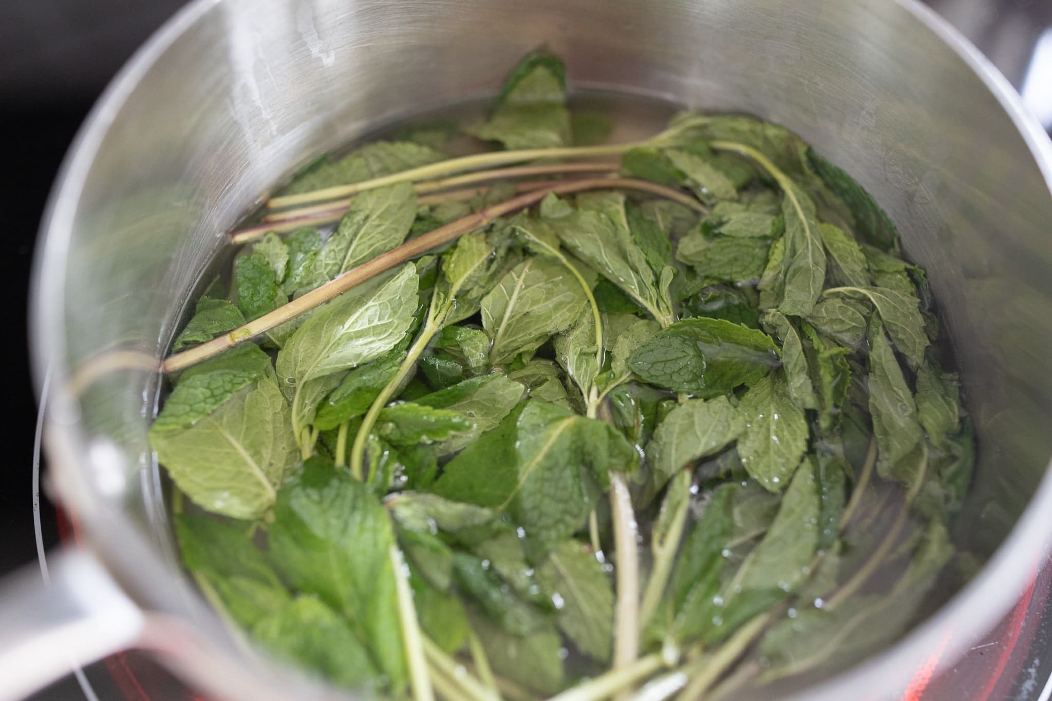 Step one of blogger Stephanie Ziajka's mint simple syrup recipe on Diary of a Debutante Step one of blogger Stephanie Ziajka's mint simple syrup recipe on Diary of a Debutante