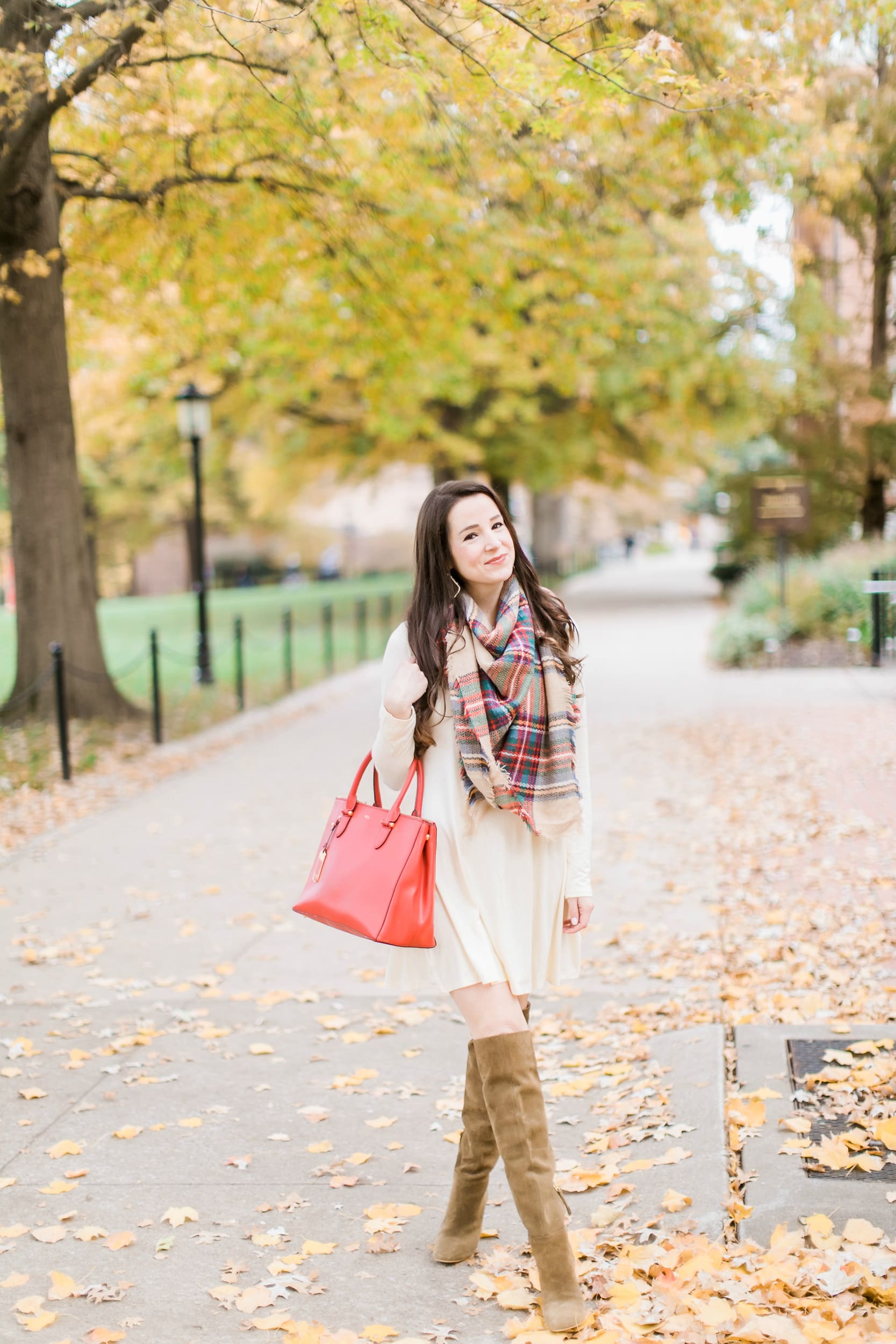 Beige cotton swing dress with tartan blanket scarf, Free People cognac OTK boots, red Ralph Lauren handbag, and Kendra Scott Sophee earrings | Casual holiday outfit idea | 10 tips for looking your best on camera | Tips for Looking Your Best in Holiday Photos from fashion blogger Stephanie Ziajka of Diary of a Debutante Beige cotton swing dress with tartan blanket scarf, Free People cognac OTK boots, red Ralph Lauren handbag, and Kendra Scott Sophee earrings | Casual holiday outfit idea | 10 tips for looking your best on camera | Tips for Looking Your Best in Holiday Photos from fashion blogger Stephanie Ziajka of Diary of a Debutante