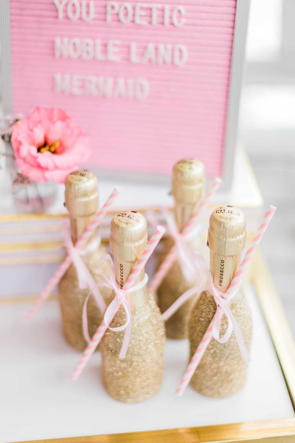 Mini glitter champagne bottles displayed on southern lifestyle blogger Stephanie Ziajka's Galentine's Day bar cart Mini glitter champagne bottles displayed on southern lifestyle blogger Stephanie Ziajka's Galentine's Day bar cart