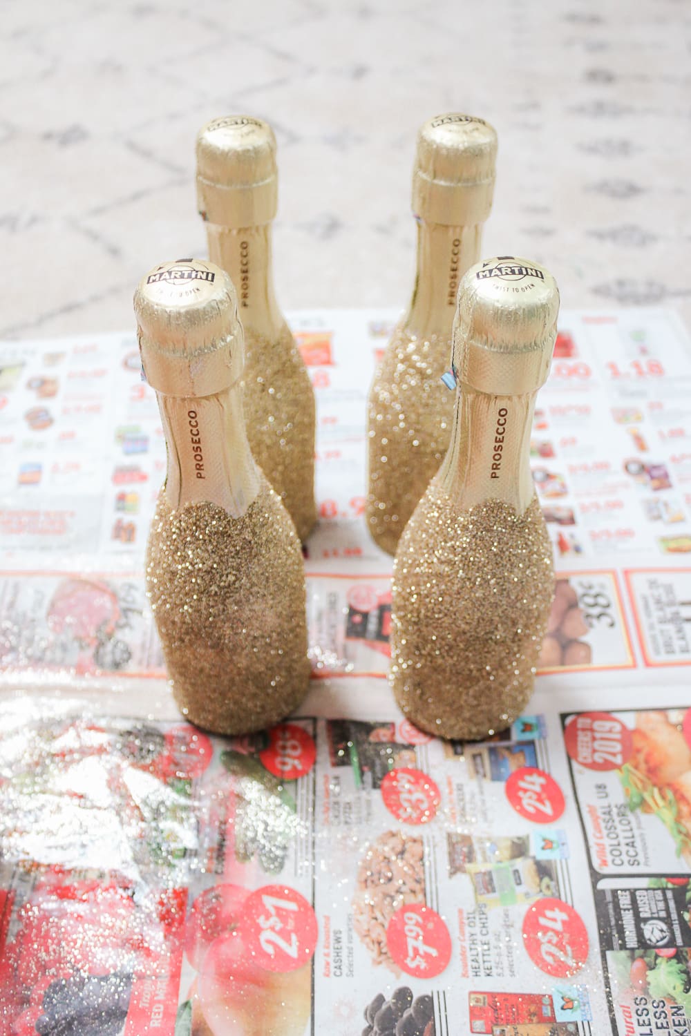 Southern lifestyle blogger Stephanie Ziajka shows how to make mini gold glitter champagne bottles on Diary of a Debutante Southern lifestyle blogger Stephanie Ziajka shows how to make mini gold glitter champagne bottles on Diary of a Debutante