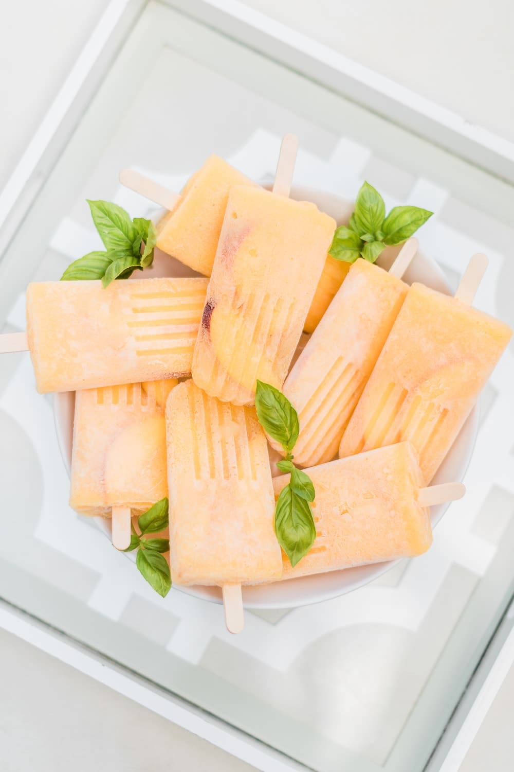 Boozy bellini popsicles recipe by southern lifestyle blogger Stephanie Ziajka on Diary of a Debutante Boozy bellini popsicles recipe by southern lifestyle blogger Stephanie Ziajka on Diary of a Debutante