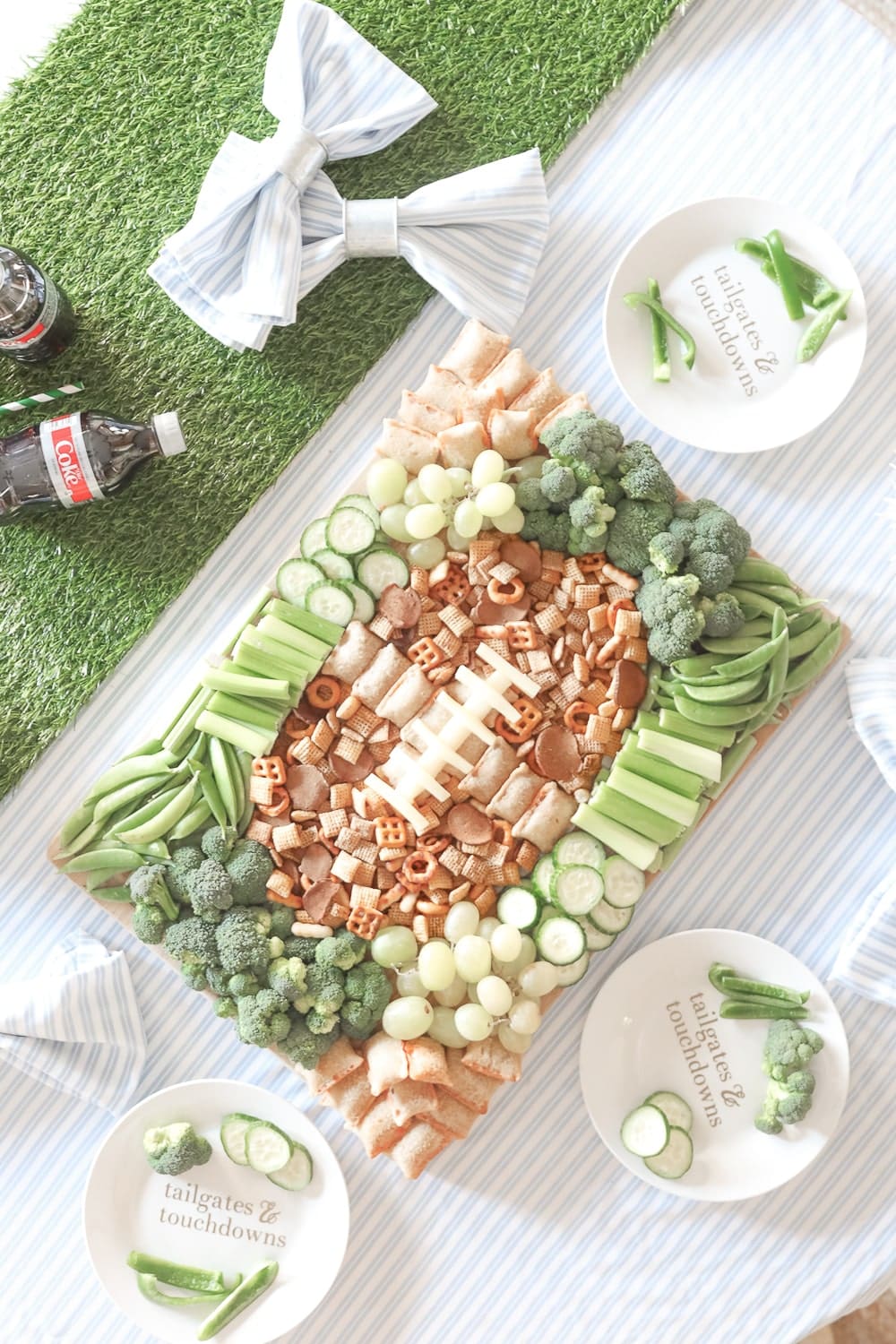 Blogger Stephanie Ziajka shows how to create a game day grazing board with green grapes, green veggies, Chex Mix, and Totino's Pizza Rolls on Diary of a Debutante Blogger Stephanie Ziajka shows how to create a game day grazing board with green grapes, green veggies, Chex Mix, and Totino's Pizza Rolls on Diary of a Debutante